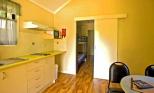 Captain Cook Holiday Village - Seventeen Seventy: Kitchen and Dining Room in Deluxe Garden Cabin