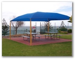 Christies Beach Tourist Park - Christies Beach: Shaded picnic area with gate to the ocean.