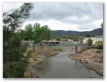 Golden Gully Caravan Park - Adelong: A view of the little bridge from up the river a little bit. It is very charming.