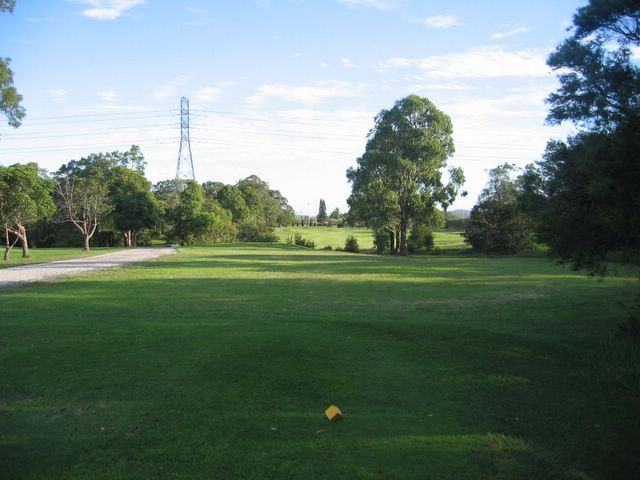 Waratah Golf Course - Argenton: Fairway view Hole 18 with gully and water directly ahead