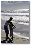 Shaws Bay Holiday Park - East Ballina: Father and son fishing on the beach