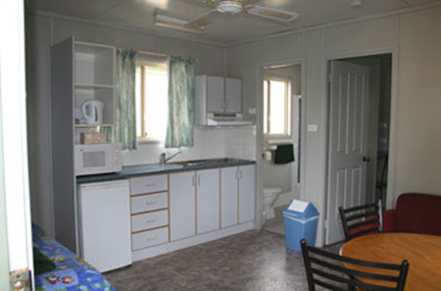 Avon Caravan Village - Bargo: Interior of cottage showing kitchen and dining area