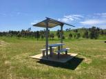 Glenriddle Reserve - Woodsreef: Sheltered picnic table.