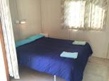 Bega Caravan Park - Bega: Main bedroom in the budget cabin accommodation.