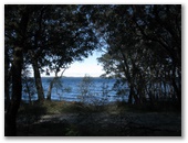 Myall Shores Nature Resort - Bombah Point Via Bulahdelah: View of lake through the trees