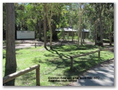 Boreen Point Bush Camping & Caravan Park - Boreen Point: Common area with small wood fired BBQ.  Amenities block behind.