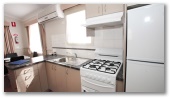 Wymah Valley Holiday Park - Bowna: Kitchen in two bedroom poolside villa