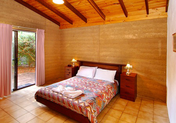 Sandy Bay Holiday Park - Busselton: Main bedroom in Rammed Earth Chalet