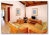 Sandy Bay Holiday Park - Busselton: Living area in Swiss Style Chalet