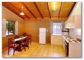 Sandy Bay Holiday Park - Busselton: Kitchen and dining area in Rammed Earth Chalet