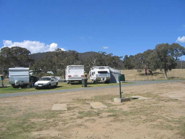 Canberra Carotel Caravan Park - Watson: Powered sites for caravans with bushland background