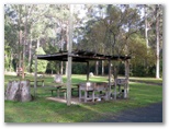 Cann River Rainforest Caravan Park - Cann River: Camp kitchen and BBQ area with area for camping in the background
