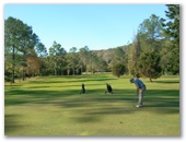 Canungra Area Golf Club - Canungra: Green on Hole 4 looking back along the fairway.