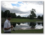 Pacific Golf Course - Carindale Brisbane: Large lake in the middle of the fairway on Hole 5 being studied by local personality and Club member Anton Donker.