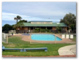 Breakers Holiday Park - Caves Beach: Swimming pool with office and reception in the background
