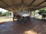 Charleville Bush Caravan Park - Charleville: bbq area with lounge chairs, book swap, lots of tables and chairs