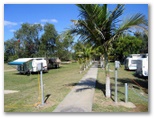Aussie Outback Oasis Cabin & Van Village - Charters Towers: Powered sites for caravans with pathway to amenities block
