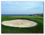 Coast Golf Course - Little Bay: Green on Hole 15 with large bunker