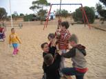 Stuart Range Caravan Park - Coober Pedy: Instant friends in the playground