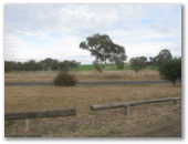 The Black Stump Rest Area - Coolah: View of the Mullaley-Coolah Road from the rest area.  Traffic is light.