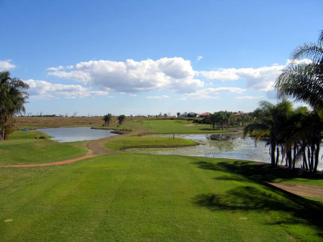 Coral Cove Golf Course - Coral Cove: Fairway view Hole 5 with challenging water obstacles