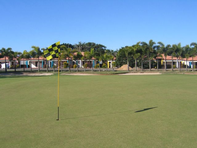 Coral Cove Golf Course - Coral Cove: Green on Hole 9 with resort in background