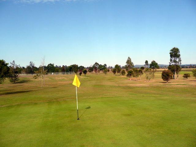 Orara Park Golf Course - Coutts Crossing: Green on Hole 1 looking back along fairway