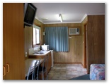 Deniliquin Riverside Caravan Park - Deniliquin: Kitchenette in motel style accommodation with ensuite bathroom shown in the far right