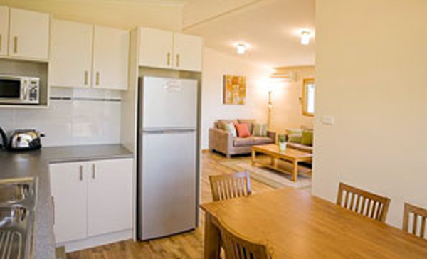 Joalah Holiday Park - Durras North: Kitchen and Lounge in Executive Cabin