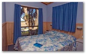 Joalah Holiday Park - Durras North: Bedroom in Waterfront and Waterview Deluxe Cabin