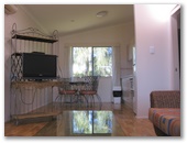 Wollongong Surf Leisure Resort - Fairy Meadow: Lounge and dining room in two bedroom bungalow