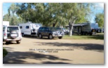 Fitzroy River Lodge Caravan Park - Fitzroy Crossing: Drive through grass caravan parking for larger vans
