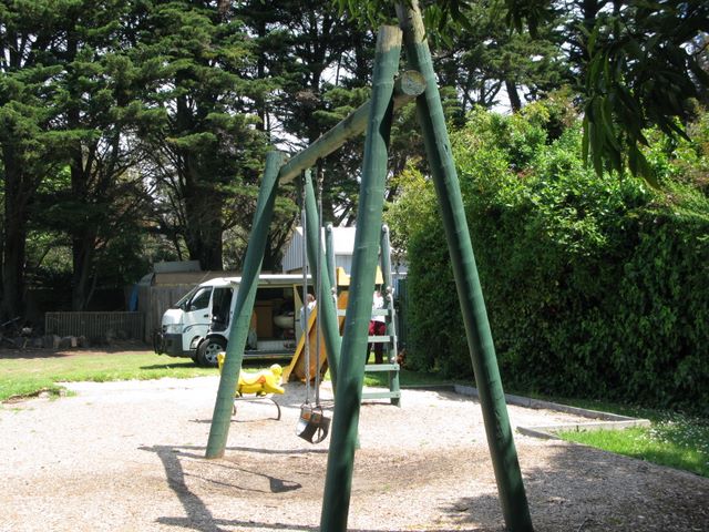 Flinders Caravan Park - Flinders: Playground for children. With powered sites in the background.  All powered sites for tourists are located in this area.