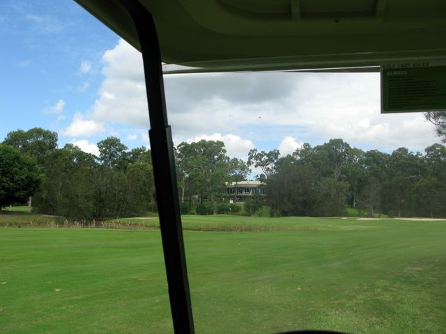 Gainsborough Greens Golf Course - Pimpama: Approach to the green on Hole with Clubhouse in the background