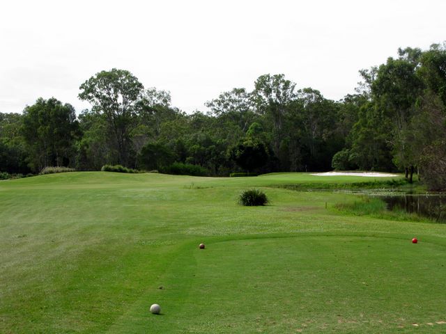 Gainsborough Greens Golf Course - Pimpama: Fairway view on Hole 17 with water to the right and in front of the green.
