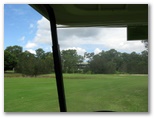 Gainsborough Greens Golf Course - Pimpama: Approach to the green on Hole with Clubhouse in the background
