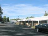 Barneys Caravan Park - Gilgandra: Motel style accommodation showing large parking area.