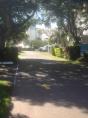 Golden Beach Holiday Park - Golden Beach Caloundra: Entrance showing good paved road and powered sites