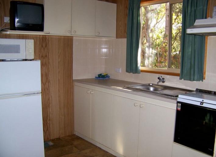 Gracetown Caravan Park - Gracetown: Interior of cabin showing kitchen.