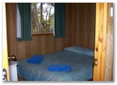 Gracetown Caravan Park - Gracetown: Interior of cabin showing bedroom.