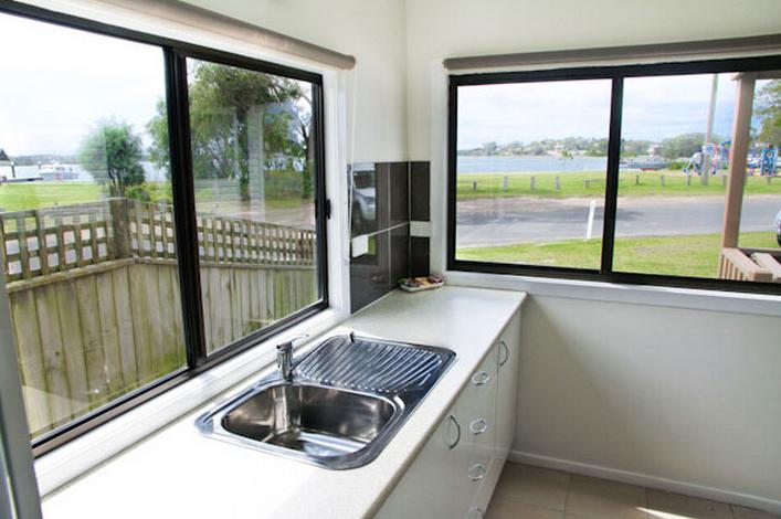 Anglers Rest Riverside Caravan Park - Greenwell Point: Kitchen with lovely water views in Studio 6