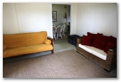 Anglers Rest Riverside Caravan Park - Greenwell Point: Lounge in Villa