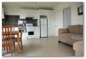 Anglers Rest Riverside Caravan Park - Greenwell Point: Dining and lounge Cabin 2