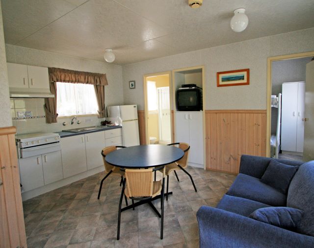 BIG4 Harrington Beach Holiday Park - Harrington: Interior of cabin showing lounge and kitchen.