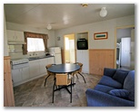 BIG4 Harrington Beach Holiday Park - Harrington: Interior of cabin showing lounge and kitchen.