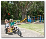BIG4 Harrington Beach Holiday Park - Harrington: Riding a bike near the children's playground.