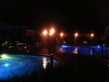 Gold Coast Holiday Park - Helensvale: Poolside at night