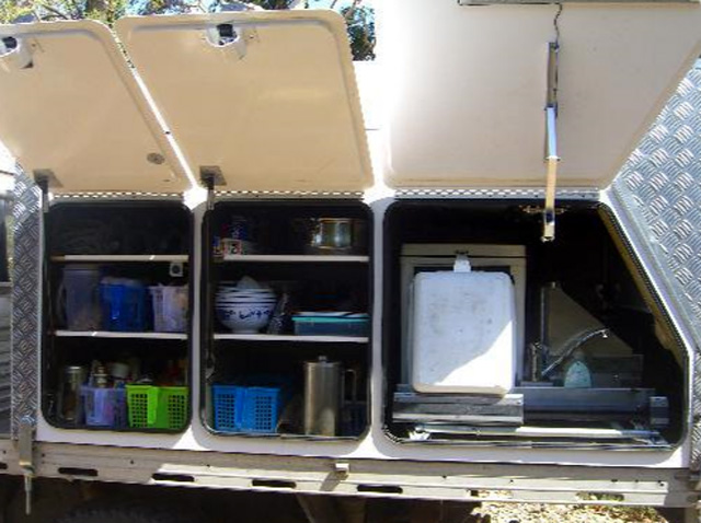 Independent Trailers - Chifley: Two large kitchen storage cupboards, kitchen slide visible packed inside