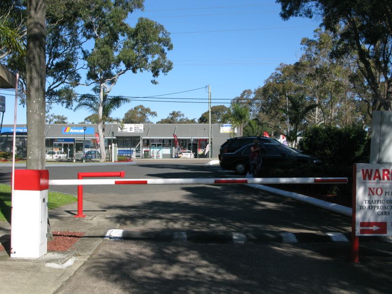 Oasis Caratel Caravan Park - Kanwal: Secure entrance and exit.  Note shopping centre opposite.