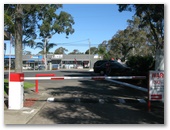 Oasis Caratel Caravan Park - Kanwal: Secure entrance and exit.  Note shopping centre opposite.